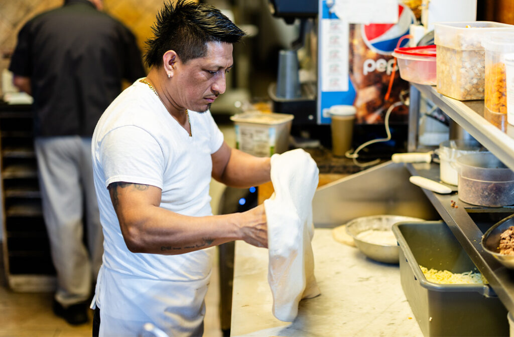 Why Is Hand-Stretching Pizza Dough Important?