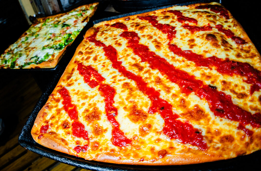 Traditional Grandma Pizza with square slices at Naples Pizza in Barnegat