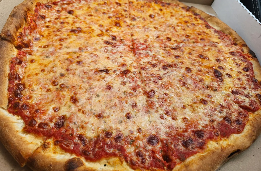 Family pizza night with fresh takeout from Naples Pizza near Toms River